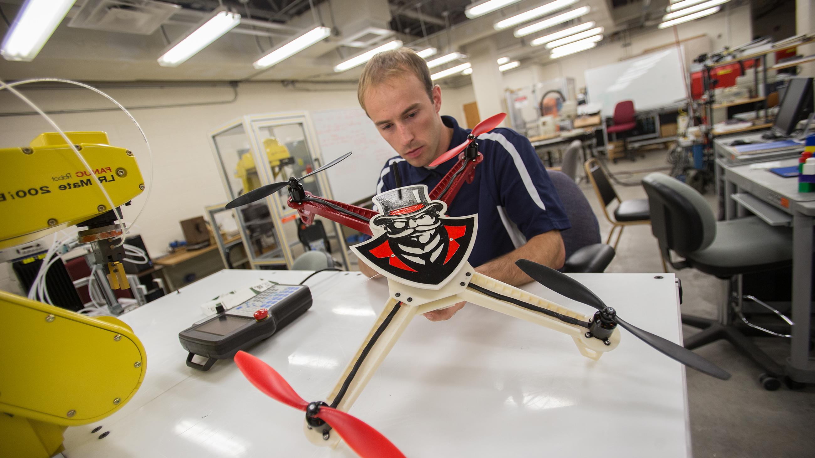 Student building drone